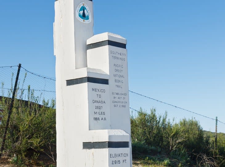 <span class="article__caption">The southern terminus of the Pacific Crest Trail in Camp, California</span> (Photo: PatrickPoendl/Getty)