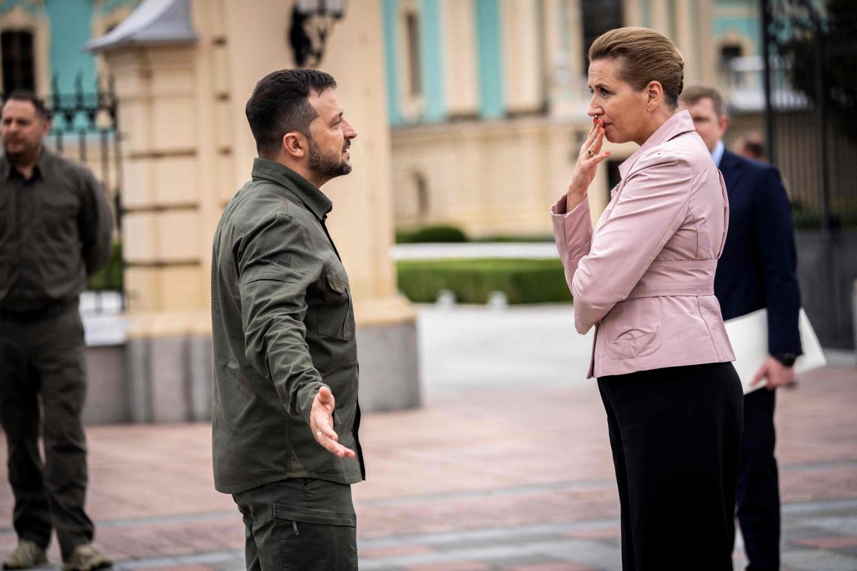 Ukrainian President Volodymyr Zelensky gestures as he talks with Denmarks Prime Minister Mette Frederiksen prior to a press conference outside the Presidential Palace following their meeting in Kyiv (Ritzau Scanpix/AFP via Getty Ima)