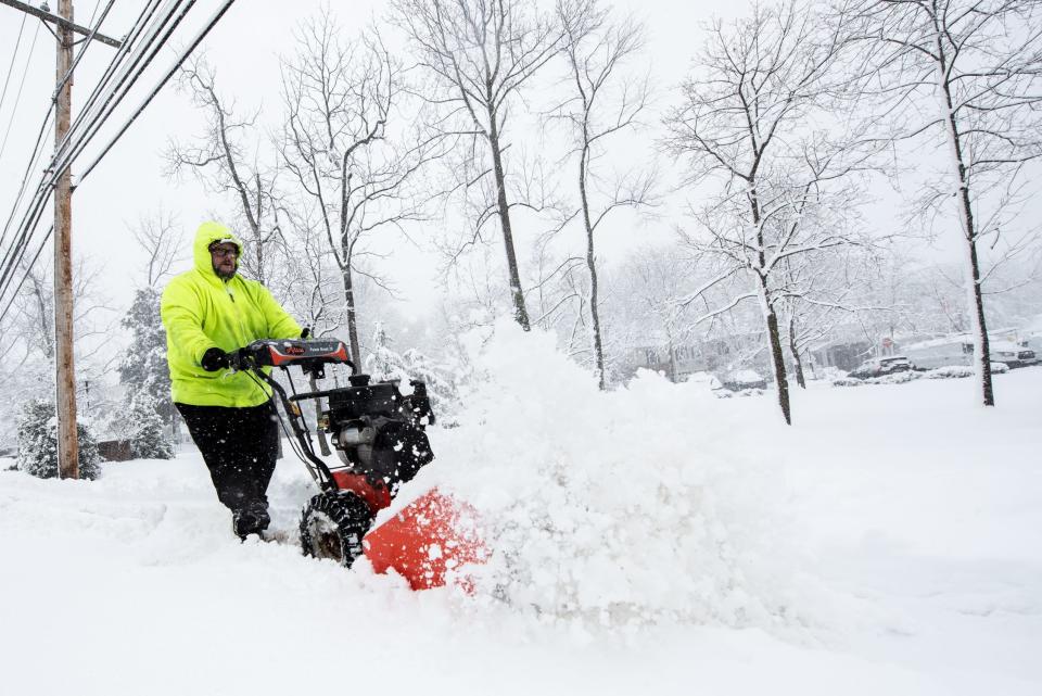 Patrick Murphy, a maintenance technician for Pine Run, clears snow from the sidewalks outside Presbyterian Senior Living Lakeview Pine Run Village in Doylestown Township, on Tuesday, February, 13, 2024.