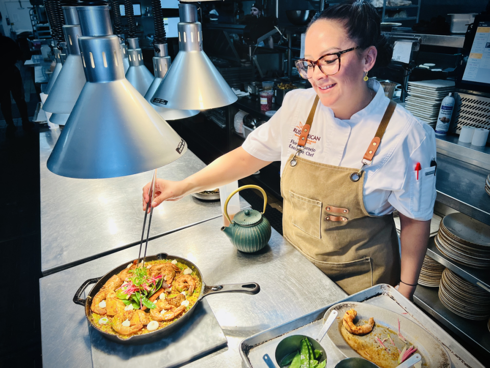 Executive Chef Fiorella Cornejo with Arroz Meloso at Rusty Pelican