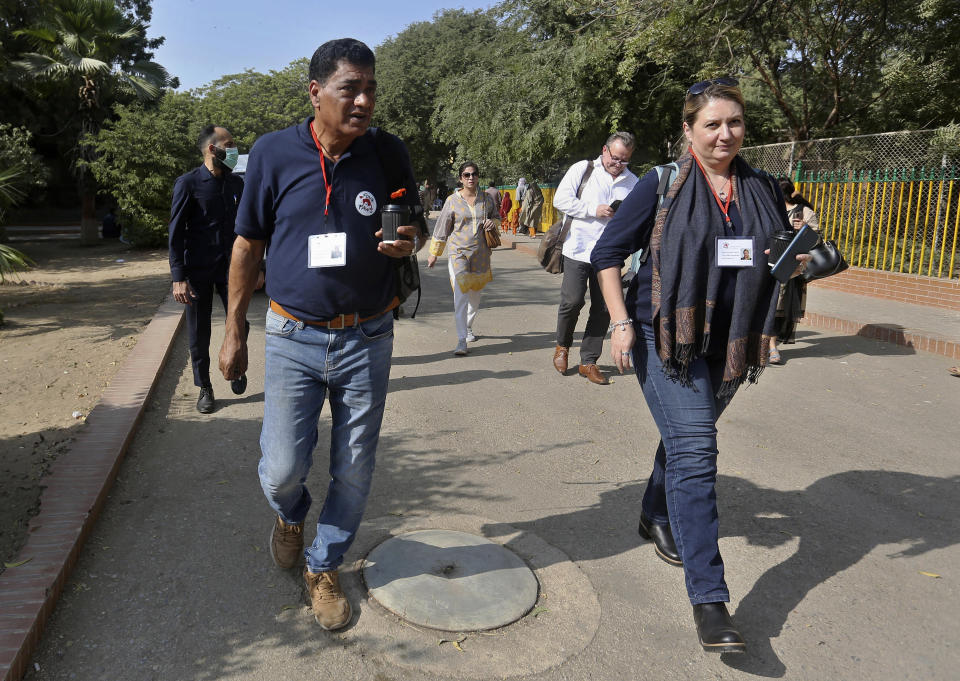 Veterinarians from the global animal welfare group, Four Paws, leave after examining elephants at Karachi Zoo, in Karachi, Pakistan, Tuesday, Nov. 30, 2021. The head of the team of vets on Tuesday called for urgent medical care for a pair of elephants in Pakistan's port city of Karachi. (AP Photo/Fareed Khan)