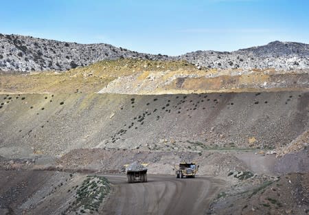 FILE PHOTO: Heavy mining equipment haul ore at the Mountain Pass Rare Earth facility in Mountain Pass, California