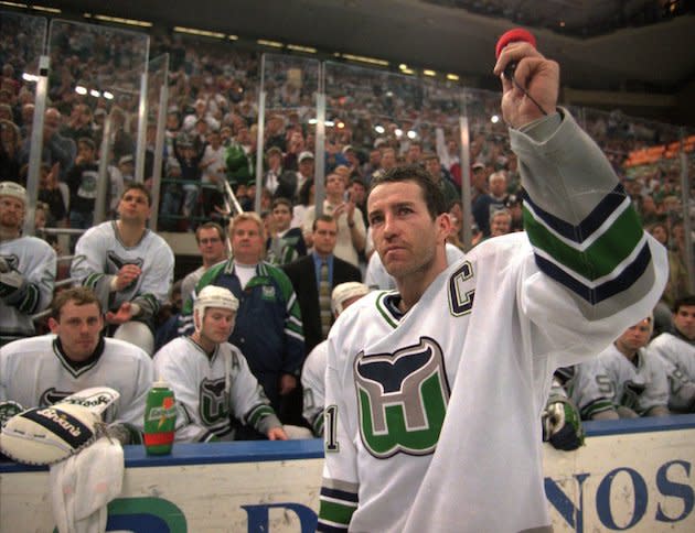 Hartford Whalers captain Kevin Dineen waves to the fans Sunday, April 13, 1997, after he briefly addressed them at the end of the Whalers final game in Hartford, Conn. The Whalers defeated the Tampa Bay Lightning 2-1 to end their season and their stay in Hartford. (AP Photo/Richard Mei)