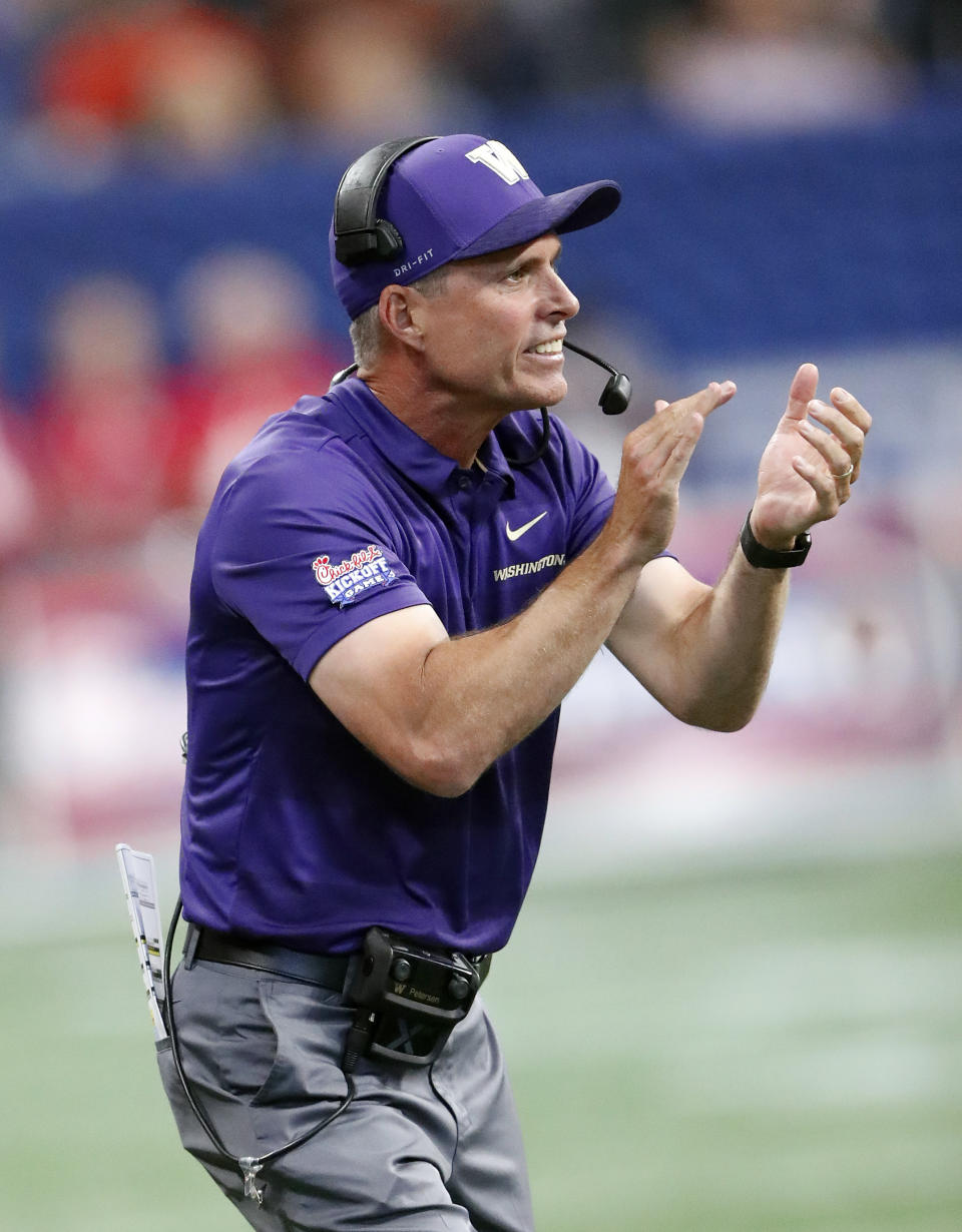 Washington head coach Chris Peterson yells to his players in the first half of an NCAA college football game against Auburn, Saturday, Sept. 1, 2018, in Atlanta. (AP Photo/John Bazemore)