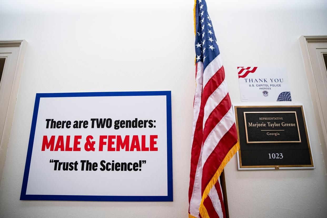 A sign hangs on the wall outside the office of Rep. Marjorie Taylor Greene (R-GA) in the Longworth House Office Building on Capitol Hill, on February 25, 2021 in Washington, DC.