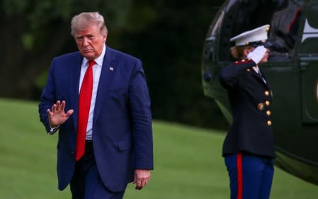 FILE PHOTO: U.S. President Donald Trump returns after travelling to the AMVETS convention in Kentucky, at the South Lawn of the White House in Washington