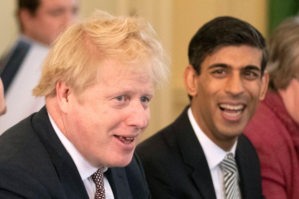 Boris Johnson, flanked by new Chancellor Rishi Sunak (POOL/AFP via Getty Images)