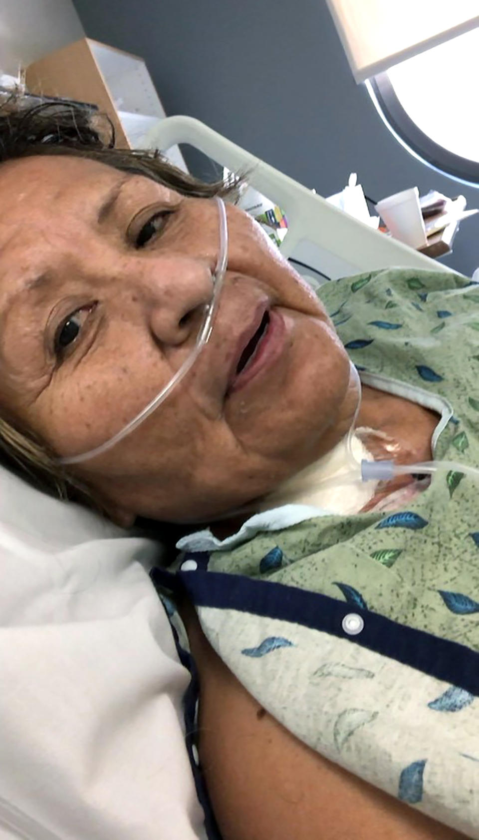 This April 17, 2020 photo provided by Shannon Todecheene shows her mother, Carol Todecheene, in a Phoenix hospital after contracting the coronavirus. Carol Todecheene was among those severely hit with the virus. (Shannon Todecheene via AP)