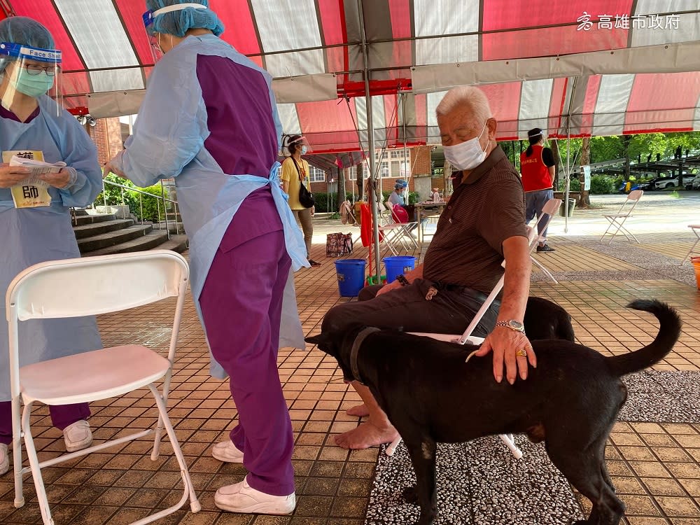 Two dogs in Kaohsiung, Taiwan, accompanied their elderly owner to a Covid-19 vaccination centre. — Picture via Facebook/ bravo.Kaohsiung