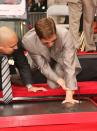 <p>While on a press tour for <em>Ocean's Thirteen</em>, Brad had a handprint and footprint ceremony at Grauman's Chinese Theater in Hollywood, California.</p>