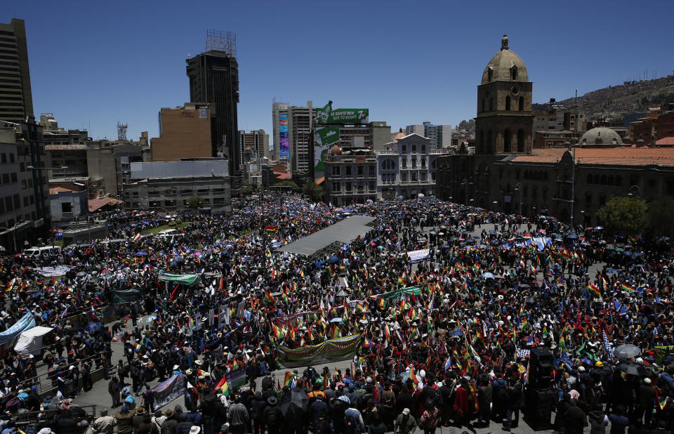 Supporters of Bolivian President Evo Morales march in La Paz, Bolivia, Wednesday, Oct. 23, 2019. Morales said Wednesday his opponents are trying to stage a coup against him as protests grow over a disputed election he claims he won outright, though a nearly finished vote count suggests it might head to a second round. (AP Photo/Juan Karita)