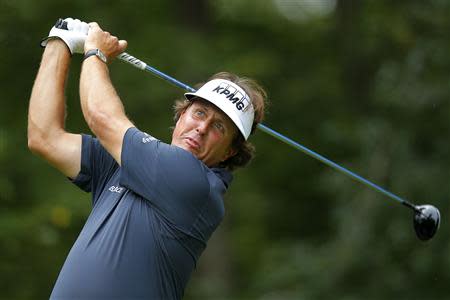 Phil Mickelson of the U.S. tees off on the first hole during the first round of the Deutsche Bank Championship golf tournament in Norton, Massachusetts August 30, 2013. REUTERS/Brian Snyder