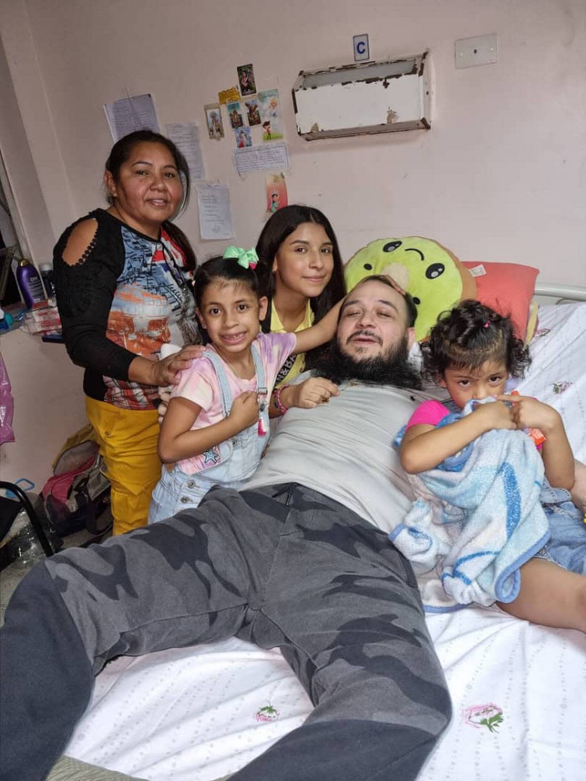 Venezuelan cattle rancher Reyes Hernández González with this family at Caracas’ Military Hospital soon after suffering a heart attack while under torture.