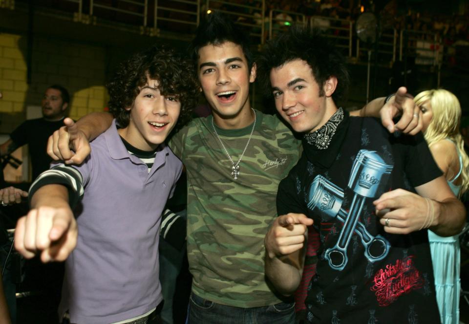 From left, Nicholas Jonas, Joseph Jonas and Kevin Jonas backstage at a concert in Anaheim, Calif., circa 2006.  