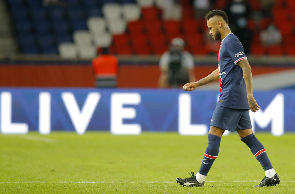 PSG???s Neymar leaves the pitch after getting a red card during the French League One soccer match between Paris Saint-Germain and Marseille at the Parc des Princes in Paris, France, Sunday, Sept.13, 2020. (AP Photo/Michel Euler)