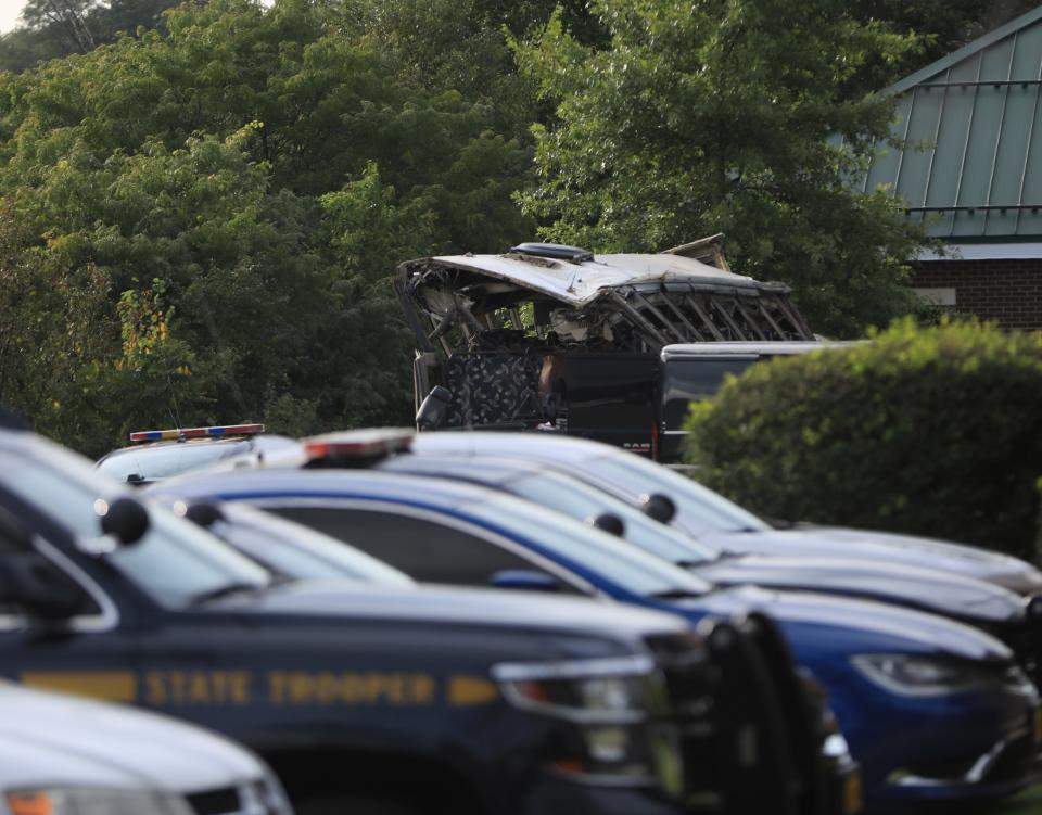 The damaged coach bus which crashed on Thursday killing 2 passengers in the back parking lot of the New York State Police Troop F barracks on Friday Sept. 22, 2023.