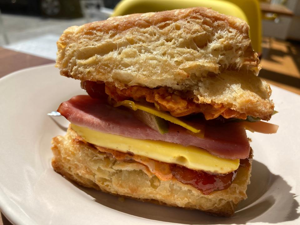 A breakfast sandwich consisting of ham, egg, brined vegetables, pimento cheese and peach Bulgarian pepper tomato jam, shown May 9, 2022 at Minifactory in Bristol.