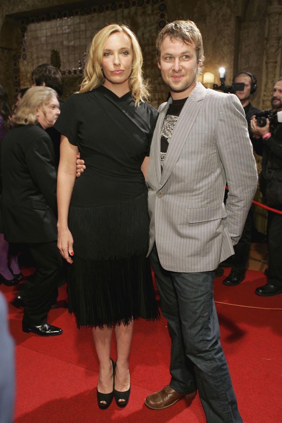 Toni Collette and husband Dave Galafassi arrive at the 2006 ARIA Hall of Fame at the Regent Theatre on Aug. 16, 2006 in Melbourne, Australia. (Kristian Dowling/Getty Images / Getty Images)