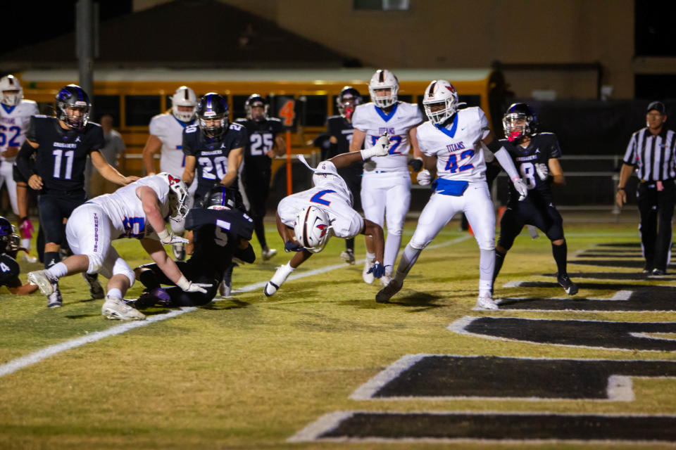 Elijah Little flips into the end zone to score a touchdown at Northwest Christian High School football field in Phoenix on Oct. 27, 2023.