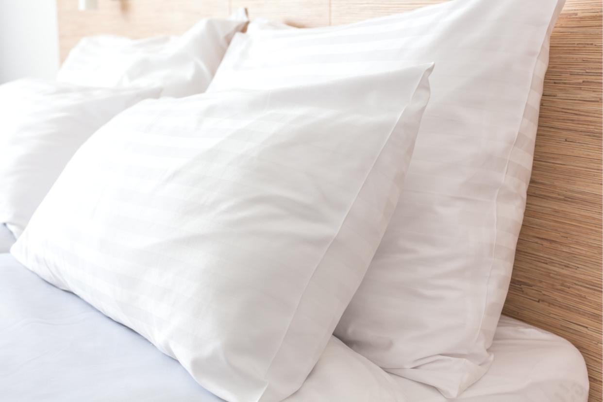 closeup of white pillows on a hotel bed