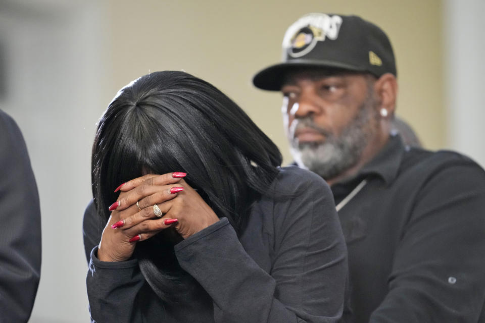 RowVaughn Wells, mother of Tyre Nichols, cries at a news conference in Memphis, Tenn., on Jan. 23, 2023.  Tyre's stepfather, Rodney Wells, stands behind her. Image: (Gerald Herbert / AP)