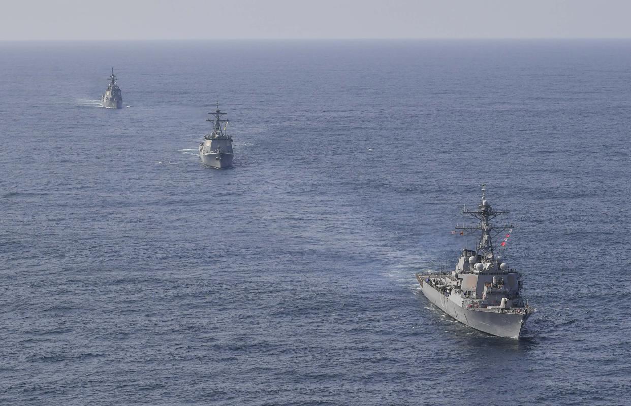 In this photo provided by South Korea Defense Ministry, U.S. Navy's the guided missile destroyer USS Benfold, right bottom, South Korean Navy's destroyer Yulgok Yi I and Japan Maritime Self-Defense Force's destroyer Atago, left top, sail during a joint missile defense drill among South Korea, the United States and Japan in the international waters of the east coast of Korean peninsular, Monday, April 17, 2023. The United States, South Korea and Japan will conduct a joint missile defense exercise Monday in waters near the Korean Peninsula as they expand military training to counter the growing threats of North Korea's nuclear-capable missiles, the South Korean navy said. (South Korea Defense Ministry via AP)