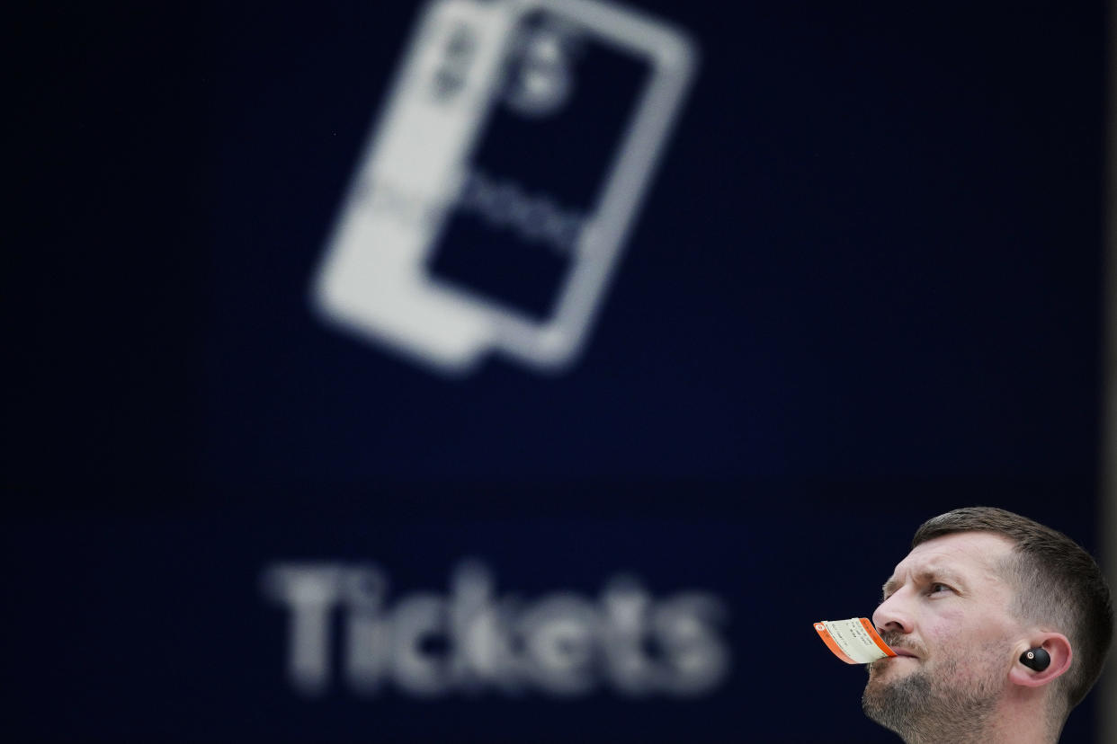 A traveller looks at the train departure board at Waterloo Station as members of the Rail, Maritime and Transport union (RMT) began fresh nationwide strikes in a bitter dispute over pay, jobs and conditions in London, Thursday, Aug. 18, 2022.(AP Photo/Frank Augstein)