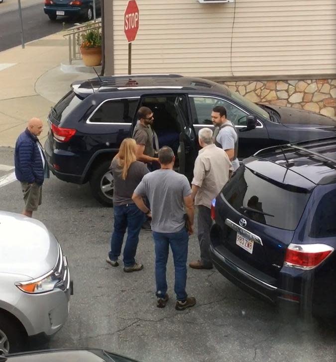 FBI, HUD and IRS agents arrested Fall River Mayor Jasiel Correia Friday morning on Peckham Street in Fall River and put him in the back of the SUV in the top of this image, taken from video, in 2019.