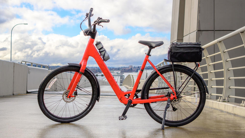 A red Trek Verve+ 1 Lowstep LT ebike with blue skies behind it.