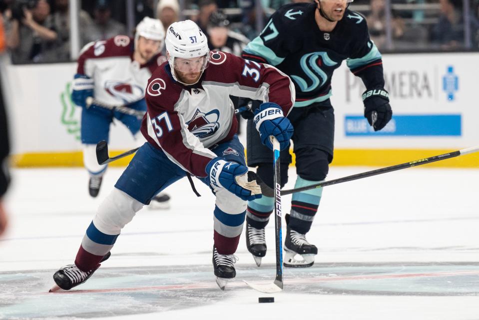 Colorado Avalanche forward J.T. Compher (37) skates with the puck against the Seattle Kraken in game four of the first round of the 2023 Stanley Cup Playoffs at Climate Pledge Arena on April 24, 2023.