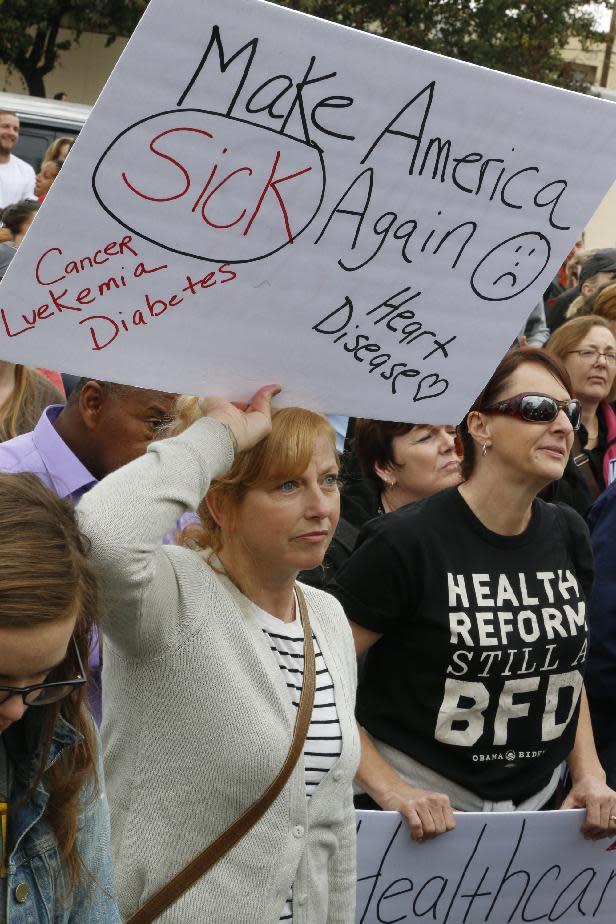 Health care workers rally to save the Affordable Care Act across the country outside LAC+USC Medical Center in Los Angeles, Sunday, Jan. 15, 2017. The rally was one of many being staged across the country in advance of President-elect Donald Trump's inauguration on Jan. 20. Trump has promised to repeal and replace the health care law, and the Republican-controlled Senate on Thursday passed a measure taking the first steps to dismantle it. (AP Photo/Damian Dovarganes)