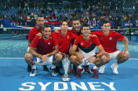 Serbia pose together with the ATP CUP after defeating Spain during their ATP Cup tennis tournament in Sydney, Monday, Jan. 13, 2020. (AP Photo/Steve Christo)
