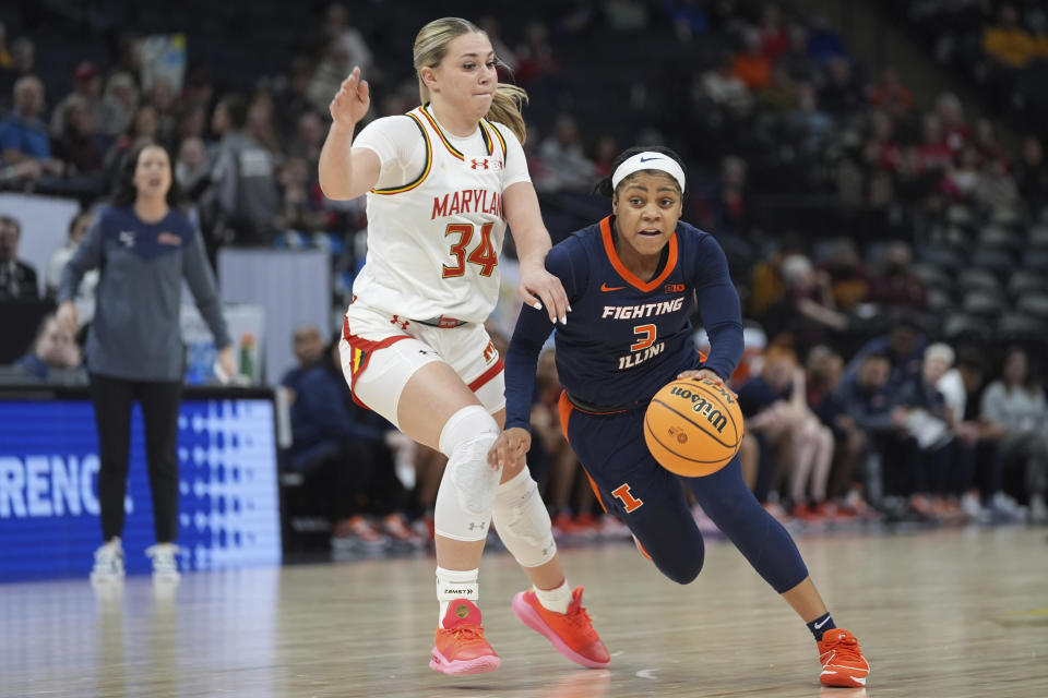 Illinois guard Makira Cook (3) works toward the basket as Maryland guard Emily Fisher (34) defends during the first half of an NCAA college basketball game at the Big Ten women's tournament Thursday, March 7, 2024, in Minneapolis. (AP Photo/Abbie Parr)