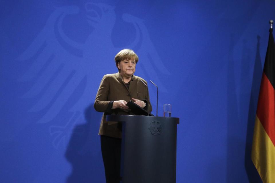 German Chancellor Angela Merkel briefs the media during a statement at the chancellery in Berlin, Friday, Dec. 23, 2016, after Anis Amri, the suspect of the terrorist attack on a Christmas market in Berlin was shot in Milan, Italy. (AP Photo/Markus Schreiber)