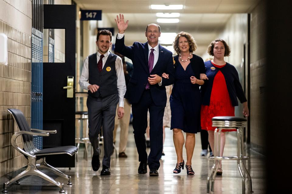 Winner of the Democratic primary for U.S. Senate Mike Franken, retired Navy admiral from Sioux City, accompanied by his family, enters his election night gathering, on Tuesday, June 7, 2022, at Franklin Junior High, in Des Moines. 