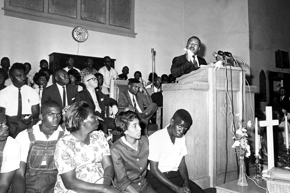 FILE - Martin Luther King Jr., wipes his face in the heat as he addresses a congregation in Montgomery, Ala., on May 25, 1965. As the country awaits a Supreme Court decision on whether one of those laws, the Voting Rights Act, will be reinforced or further eroded, a small, vanishing group who lived at the epicenter of the struggle for voting rights six decades ago is reflecting on the times and their struggles, and why it was worth it.(AP Photo)