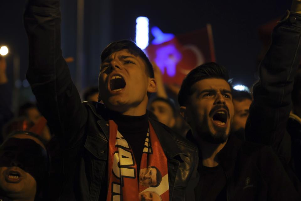 Supporters of Republican People's Party shout slogans outside the headquarters of CHP, in Ankara, Turkey, Sunday, May 14, 2023. More than 64 million people, including 3.4 million overseas voters, were eligible to vote. (AP Photo)