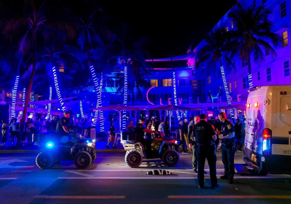 Police officers patrol near the Clevelander in Miami Beach on Friday, March 25, 2022, after city officials imposed a midnight curfew.