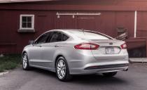 <p>As seen on the last slide, there’s a distinctly Aston Martin–like flair to the Fusion’s face, but that’s not a bad thing (unless, perhaps, you own an Aston). A slinky side view and a smart interior bring together the package nicely.</p>