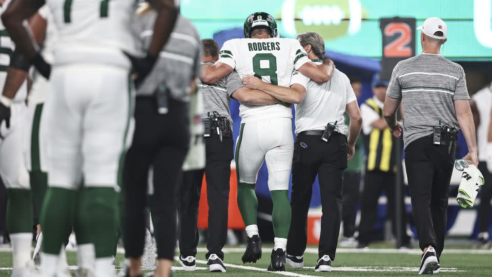 Rodgers is helped off the field against the Bills after suffering an injury. - Michael Owens/Getty Images