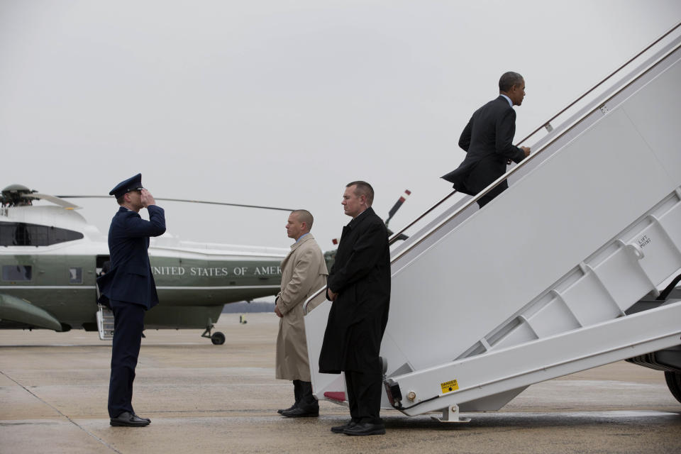 President Barack Obama boards Air Force One at Andrews Air Force Base, Md., Wednesday, Feb. 19, 2014, prior to traveling to Toluca, Mexico to participate in the seventh trilateral North American Leaders Summit Meeting, where he will meet with Canadian Prime Minister Stephen Harper and Mexican President Enrique Peña Nieto. This year's theme is “North American Competitiveness.”(AP Photo/Jacquelyn Martin)