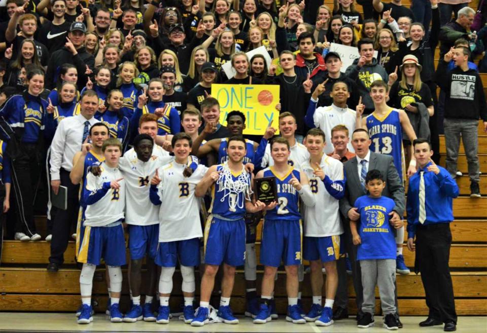 The Clear Spring boys basketball team celebrates its second Maryland Class 1A West championship in three seasons in front of the Blazers fan section on March 3, 2018, at Frostburg State University.