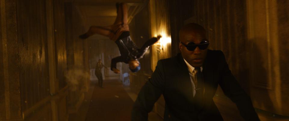 Bugs (Jessica Henwick) aids Morpheus (Yahya Abdul-Mateen II)
in "Matrix Resurrections."