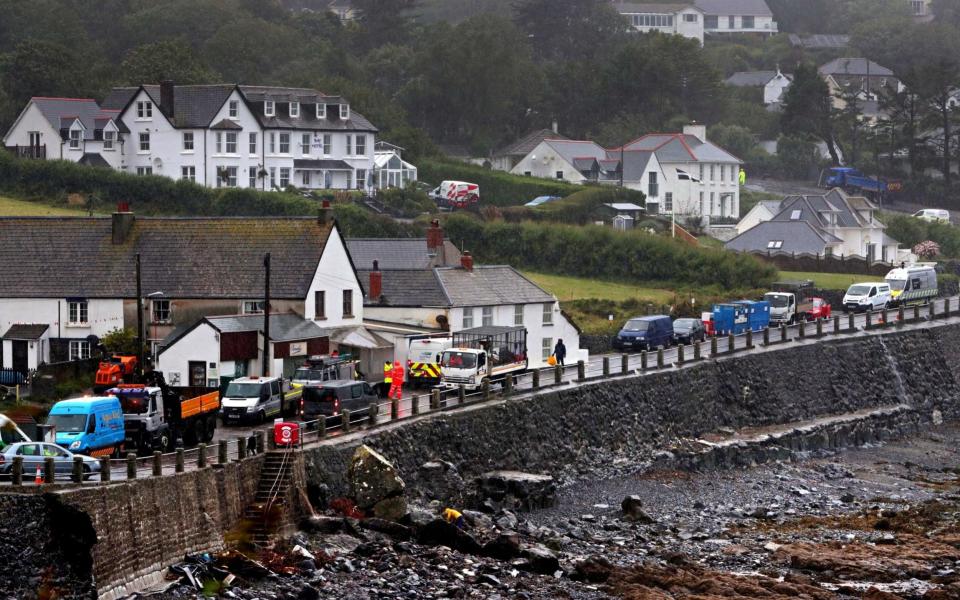 Sailors from RNAS Culdrose help the clean up operation after flooding in the village of Coverack - Credit: Dan Rosenbaum/MoD/Crown Co