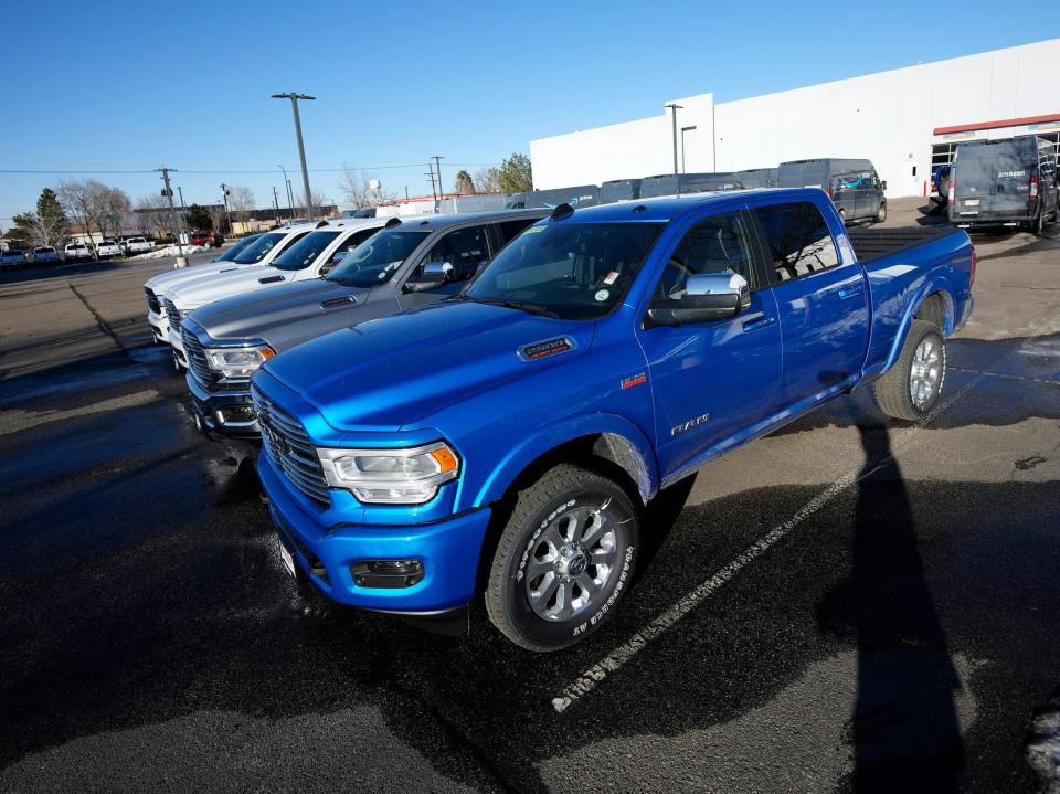 Pickup trucks at a car dealership.