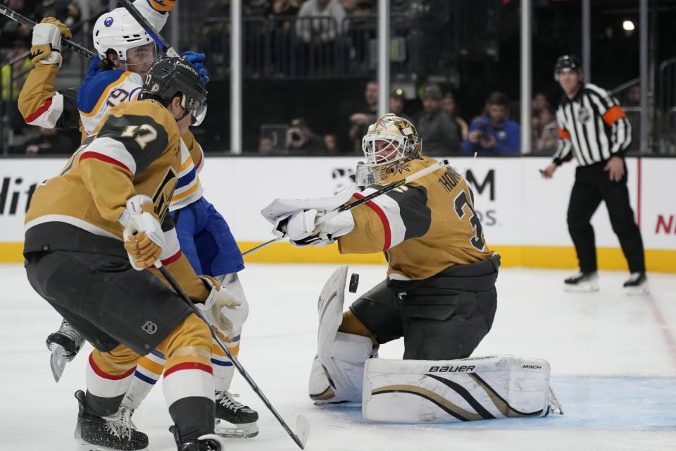 Vegas Golden Knights goaltender Logan Thompson (36) makes a save against the Buffalo Sabres during the first period of an NHL hockey game Friday, Dec. 15, 2023, in Las Vegas. (AP Photo/John Locher)