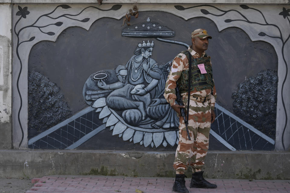 A paramilitary soldier patrols a street in Jammu, India, Tuesday, Oct. 4, 2022. The prisons chief in Indian-controlled Kashmir has been killed, officials said Tuesday, as India’s powerful home minister arrived in the disputed Himalayan region on a three-day visit. (AP Photo/Channi Anand)