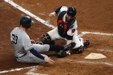 Oct 21, 2017; Houston, TX, USA; New York Yankees first baseman Greg Bird (33) is out at home as Houston Astros catcher Brian McCann (16) applies the tag during the fifth inning in game seven of the 2017 ALCS playoff baseball series at Minute Maid Park. Troy Taormina-USA TODAY Sports