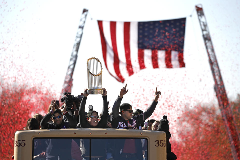 Washington Nationals general manager Mike Rizzo holds up the World Series trophy during a parade to celebrate the team's World Series baseball championship over the Houston Astros, Saturday, Nov. 2, 2019, in Washington. (AP Photo/Patrick Semansky)