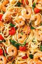 <p>Linguine with tomatoes, greens, and prawns in a buttery sauce = bomb.</p><p> the <a href="https://www.delish.com/uk/cooking/recipes/a30219265/creamy-shrimp-linguine-tomatoes-kale-lemon-zest-recipe/" rel="nofollow noopener" target="_blank" data-ylk="slk:Creamy Prawn Linguine;elm:context_link;itc:0;sec:content-canvas" class="link ">Creamy Prawn Linguine</a> recipe.</p>